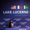 A member of the Qatari delegation makes adjustments ahead of a quadrilateral meeting between the U.S., Iran, Pakistan, and Qatar at the Lake Lucerne Summit, June 21, 2026.