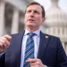 Rep. Dan Goldman talks with a reporter outside the U.S. Capitol on December 18, 2025
