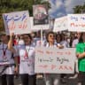 Supporters participate in a protest marking the third anniversary of Mahsa Jina Amini's death in memory of the Iranian victims of the Women, Life, Freedom movement at Queen's Park in Toronto on September 14, 2025.