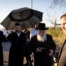 A convoy of Ultra-Orthodox Jewish men rally against the military inscription, on road 1 outside of Jerusalem, June 24, 2026. 