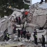 Rescuers search for victims in a collapsed building following an earthquake in Caracas on June 24, 2026.