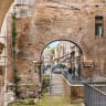 The Portico d'Ottavia, a prominent ancient Roman structure located in the historical Jewish Ghetto quarter of Rome (Illustrative).