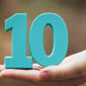 Open hand holds the number 10 (illustrative).