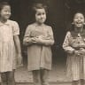 A JEWISH GIRL and her Chinese friends in the Shanghai Ghetto, 1945, from the collection of the Shanghai Jewish Refugees Museum.