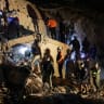 Emergency services work at the site of a collapsed building after earthquakes hit the country, in Caracas, Venezuela, June 24, 2026.