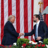 US President Donald Trump shakes hands with Vice President JD Vance during a Memorial Day ceremony at Arlington National Cemetery, earlier this year.
