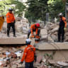 Emergency services work at the site of a collapsed building after earthquakes hit the country, in Caracas, Venezuela, June 25, 2026. 
