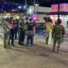 Security personnel and emergency responders stand at the site where a car rammed through a crowd of Mexico soccer fans, in Cabo San Lucas, Mexico, in this handout released on June 25, 2026. 