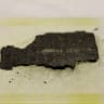 FILE PHOTO: Fragment of Herculaneum scroll is fixed in place at a Diamond Light Source experimental station after it was scanned using bright x-rays in Didcot, Britain, September 30, 2019. 
