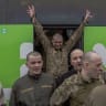  UKRAINE-RUSSIA-CONFLICT-WAR-POW Released Ukrainian prisoners of war (POWs) react upon arrival by bus following a prisoner exchange at an undisclosed location, in the Chernihiv region on May 15, 2026, amid the Russian invasion of Ukraine.