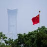 China's national flag flutters in the wind next to the CITIC tower ahead of Brunei's Crown Prince Al-Muhtadee Billah and China's President Xi Jinping meeting on May 12, 2026 in Beijing, China. 