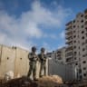 Israeli Border Police officers and security forces operate near the Israeli separation barrier adjacent to the Palestinian neighborhood of Kafr Aqab, in the West Bank, June 22, 2026.