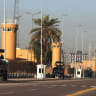 Security is stationed outside the US Embassy is seen in Baghdad's fortified "Green Zone" on March 17, 2026.