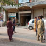People stand in the street following an earthquake in Peshawar, Pakistan June 27, 2026. Picture taken with a mobile phone.