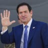 US Secretary of State Marco Rubio waves as he boards a US Air Force C-17 Globemaster III transport aircraft after his visit to the Middle East to discuss the interim deal between the US and Iran with Arab Gulf allies, in Manama on June 25, 2026.
