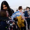 Jewish immigrants fleeing the war in Ukraine, on a rescue flight sponosred by the IFCJ, arrive at Ben Gurion airport near Tel Aviv on March 6, 2022.