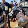 A journalist holds the blood-covered camera belonging to Palestinian photojournalist Mariam Dagga, a journalist who freelanced for AP since the start of the war and who was killed in an Israeli strike on Nasser hospital in Khan Yunis in the southern Gaza Strip, during her funeral on August 25, 2025.