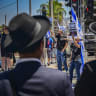 Protesters supporting the conscription of ultra-Orthodox Jewish men into the Israeli military block a road in the ultra-Orthodox city of Bnei Brak, central Israel, in protest against the continued road blockades by ultra-Orthodox demonstrators following the arrest of draft evaders, June 26, 2026. 