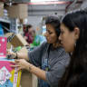 Volunteers pack kits to distribute to young families in Jerusalem, during war between Iran and Israel, June 15, 2025. 