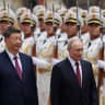 Russian President Vladimir Putin and Chinese President Xi Jinping inspect an honor guard during a welcoming ceremony at the Great Hall of the People in Beijing, China May 20, 2026.