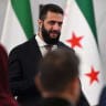 Syrian President Ahmed al-Sharaa arrives to attend the second day of the first Syrian-Emirati (United Arab Emirates) Investment Forum, at the People's Palace in Damascus on May 12, 2026.