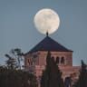 Shining: Moon rises behind the Mount of Olives, Jerusalem.