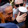 Israeli cabinet minister and former military chief Gadi Eisenkot is consoled by Israeli Prime Minister Benjamin Netanyahu, as he attends the funeral of his son Gal Meir Eisenkot, 25, an Israeli solider, who was killed in northern Gaza during the ground operation by Israel's military in Gaza.