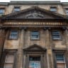 People pass the now derelict Royal Mineral Water Hospital that is awaiting redevelopment on February 19, 2026 in Bath, England. 