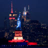 The Statue of Liberty is lit up ahead of the commemoration of the 250th anniversary of US independence, on July 1, 2026.