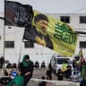 A flag depicting late former Hezbollah leader Hassan Nasrallah flutters as Shi'ite mourners mark Ashura, in the southern suburbs of Beirut, Lebanon, June 26, 2026