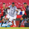 GIOVANI DOS SANTOS (L) of Club America fights for the ball with Luis Reyes (R) of Atlas during the 7th round match between in Guadalajara, Mexico, in 2021. 