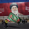 Shi'ite mourners walk past a banner depicting Iran's late Supreme leader Ayatollah Ali Khamenei as they mark Ashura, the holiest day on the Shi'ite Muslim calendar, in the southern suburbs of Beirut, Lebanon, June 26, 2026.