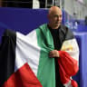 Hossam Hassan, Head Coach of Egypt, holds the flag of Palestine after the team's victory through the penalty shootout during the FIFA World Cup 2026 Round of 32 match between Australia and Egypt at Dallas Stadium on July 03, 2026 in Arlington, Texas. 