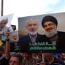 Demonstrators carry pictures of Hamas leaders Ismail Haniyeh and Yahya Sinwar, and Hezbollah leader Sayyed Hassan Nasrallah during a protest in support of Lebanon and Gaza, in Tunis, Tunisia October 7, 2024