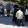 A faithful receives a blessing in front of the traditionalist Catholic Society of Saint Pius X (SSPX) in Econe, Switzerland, July 2, 2026.