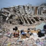 A man sits near a destroyed building in Macuto, Vargas state, Venezuela, on July 5, 2026.