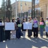 Women activists protest in Aleppo against what they say is inadequate female representation in Syria's newly formed People's Assembly, July 2.