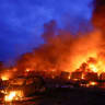 Cars and private garages of residents burn after Russian missile and drone strikes, amid Russia's attack on Ukraine, in Kyiv, Ukraine, July 6, 2026.
