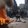 Protesters gather outside a building they believe is occupied by undocumented foreign nationals during a demonstration by the "March and March" in Johannesburg, South Afrfica, June 30, 2026.