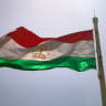A Tajik national flag flies in the wind in the Tajik exclave of Vorukh in the Kyrgyz Batken region, where multiple deadly border conflicts between the two Central Asian nations took place since the fall of the Soviet Union, on May 24, 2025. 