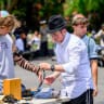 A man puts on a tefillin in Washington Square Park in Manhattan on June 19, 2026 in New York City. Tefillin are a Jewish traditional ritual object, believed to be an approximately 2000 year old tradition.