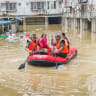 Paramilitary police officers evacuate residents in a rubber dinghy through a flooded area after rainfall brought by typhoon Maysak, in Nanning, Guangxi Zhuang Autonomous Region, China July 6, 2026.