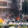 Smoke and fire rise at the site where explosive devices blew up near a hotel where French President Emmanuel Macron was meant to be staying, in Damascus, Syria, in this screengrab obtained from a video, July 7, 2026.