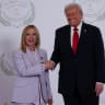 US President Donald Trump and Italian Prime Minister Giorgia Meloni shake hands as they pose for a photo, at a world leaders' summit on ending the Gaza war, amid a U.S.-brokered prisoner-hostage swap and ceasefire deal between Israel and Hamas, in Sharm el-Sheikh, Egypt, October 13, 2025.