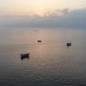 This aerial photograph shows boats anchored off Oman's northern Musandam Peninsula near the Strait of Hormuz on June 27, 2026.