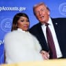 Musician Nicki Minaj (L) joins U.S. President Donald Trump on stage as he delivers remarks during the Treasury Department's Trump Accounts Summit at Andrew W. Mellon Auditorium on January 28, 2026 in Washington, DC.