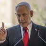 Prime Minister Benjamin Netanyahu speaks during a cornerstone laying ceremony for the Atarot Heritage Center in east Jerusalem near the separation wall with the West Bank on July 5, 2026. 