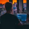 A man writing a code on his conputer