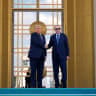US President Donald Trump shakes hands with Turkish President Recep Tayyip Erdogan as he arrives at the Bestepe Presidential Palace during a formal welcome for the NATO summit in Ankara, Turkey, Tuesday, July 7, 2026.