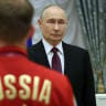 Russian President Vladimir Putin listens to the national anhem during an awards ceremony at the Kremlin, on March 19, 2026 in Moscow, Russia. Vladimir Putin receives national paralympic team who participaned in Milano Cortina 2026 Winter Paralympic Games. 